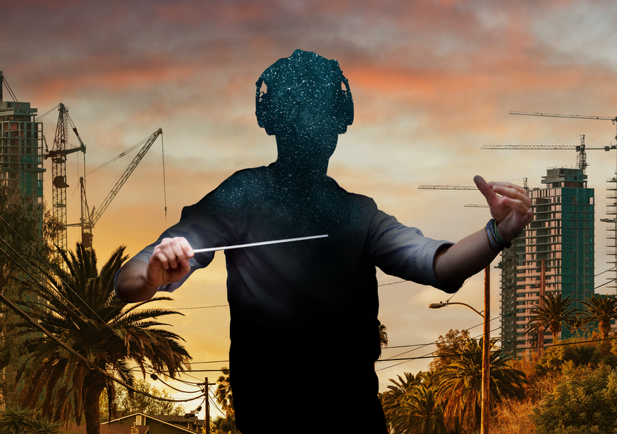 A faceless person holding a conductor's baton and wearing headphones surrounded by a cityscape.