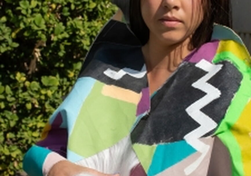 woman in traditional native american style standing posing for photo