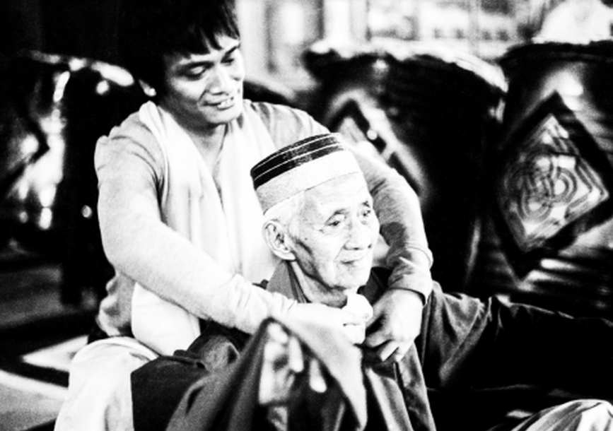 man taking care of elder 