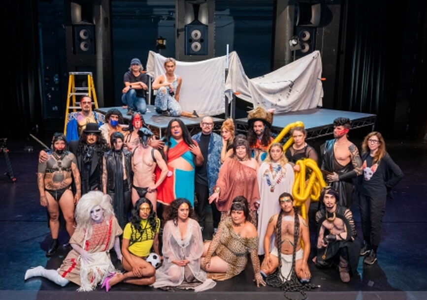 full cast and crew on stage for photo