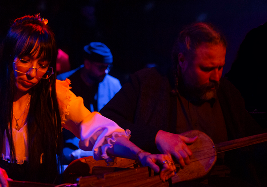 Lisa and Joshua play instruments.