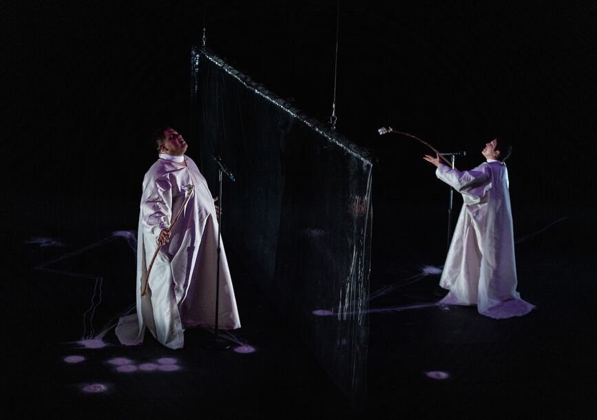 graphic with 2 people dressed in white gowns