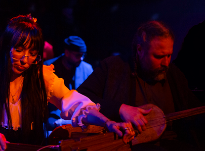 Lisa and Joshua play instruments.