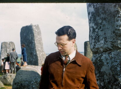 man in front of rocks