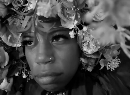 lady in floral headwear